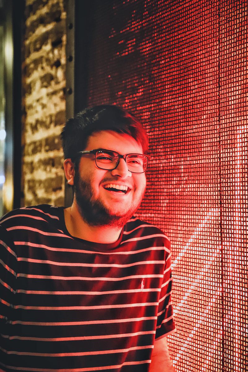 man standing beside window