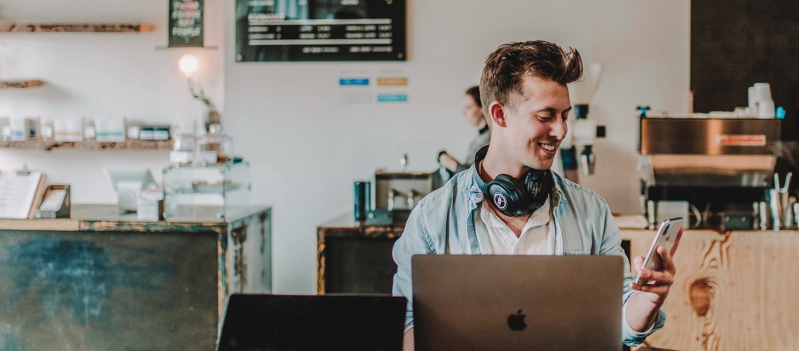 man using smartphone smiling