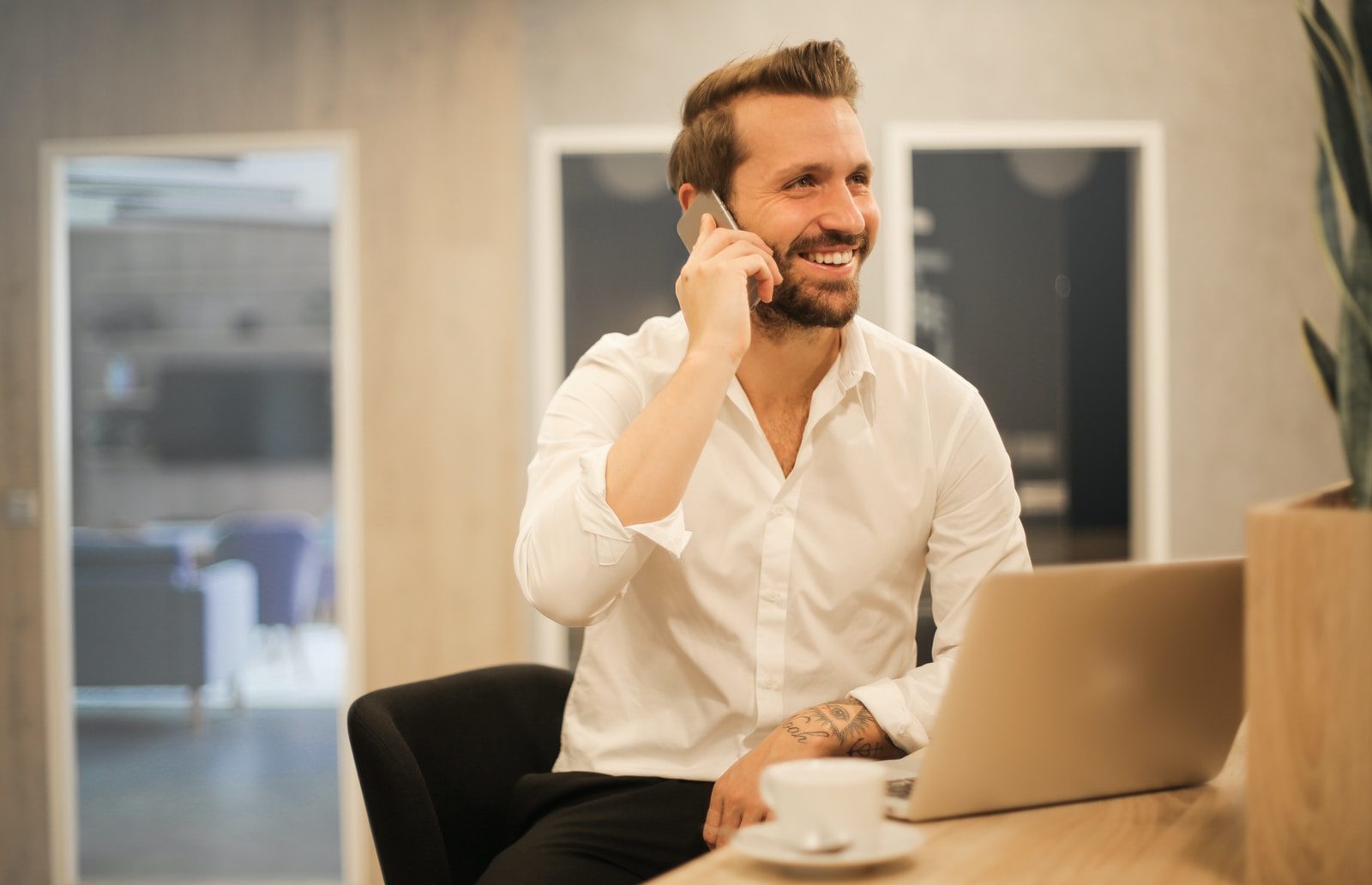 man using smartphone on chair