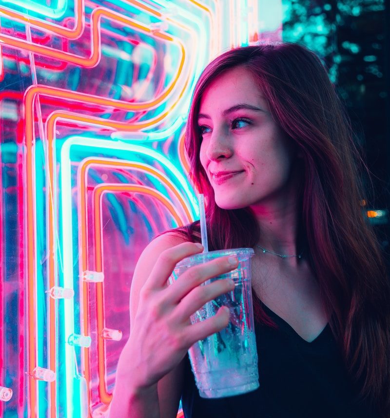 woman holding disposable cup