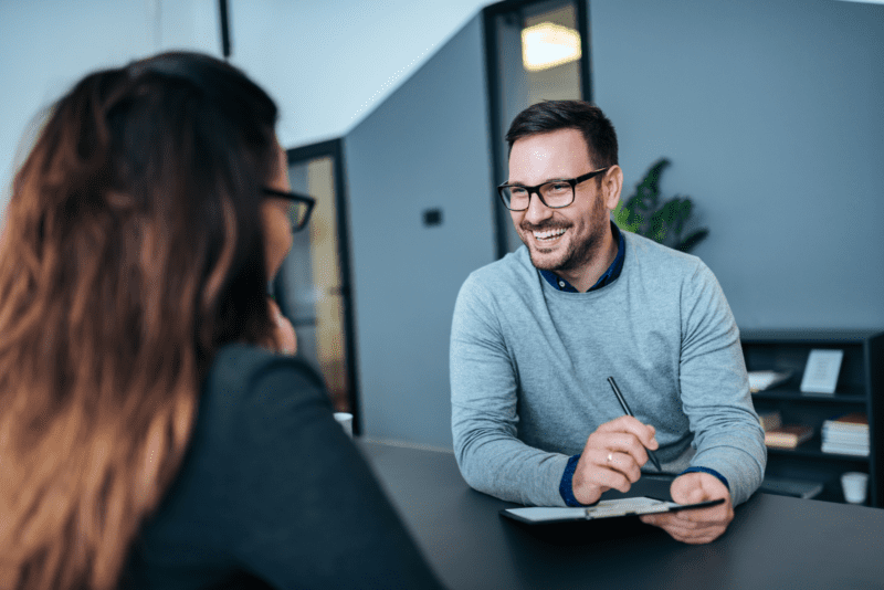 Female being interviewed by a male for a job.