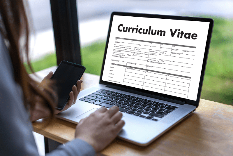 Upload your CV. Lap top screen with curriculum vitae on the screen.