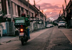 a person riding a motorcycle down a street