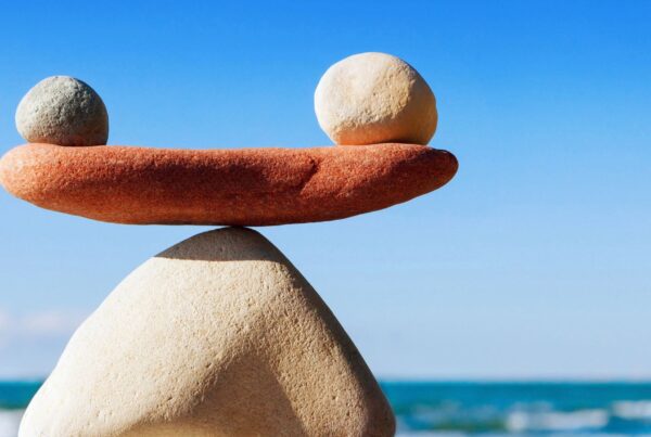 balancing stones on a beach